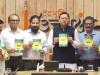 सीएम धामी ने 'छात्रों का सतत कल्याण' पुस्तक का किया विमोचन 
